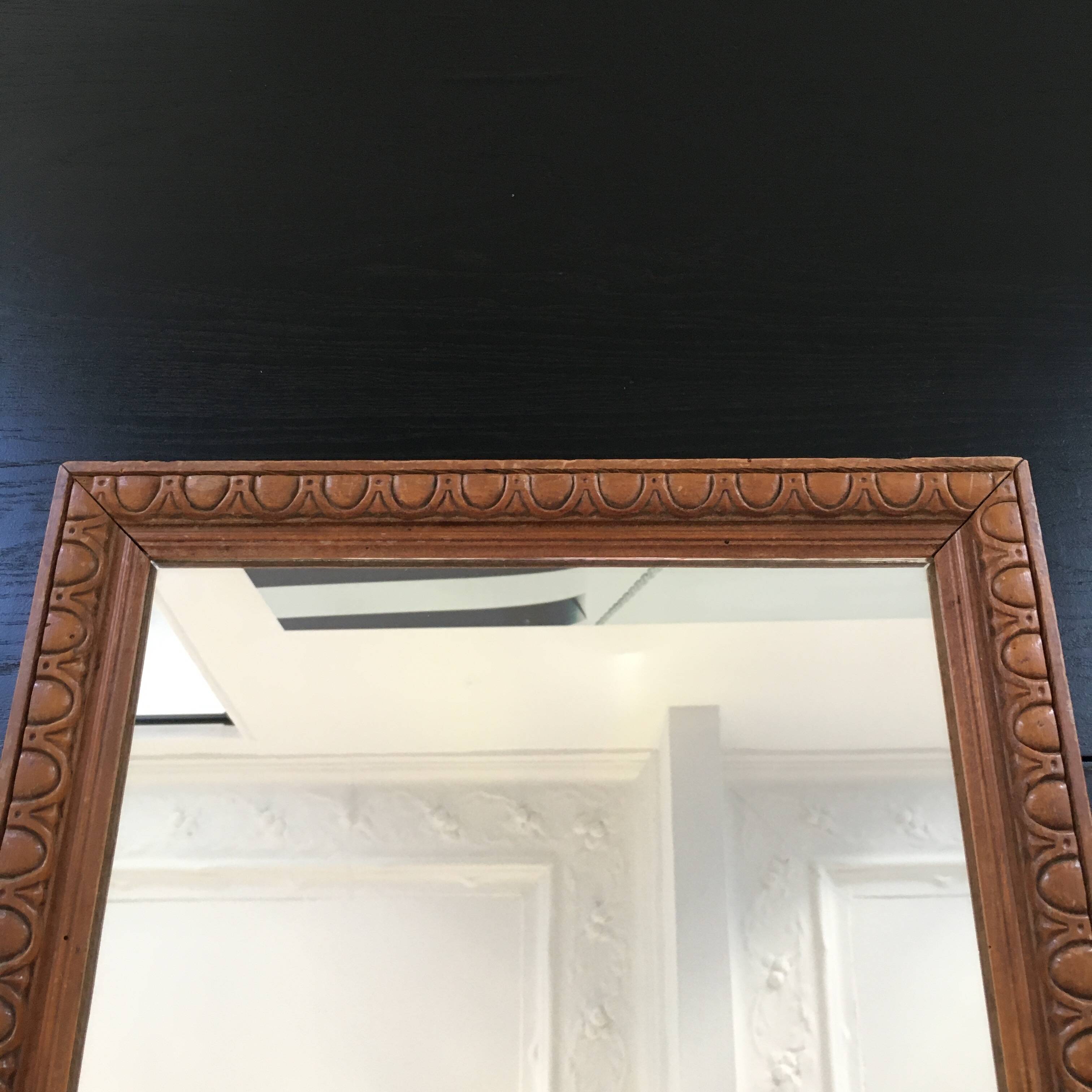 Antique mirror in ornate wood
