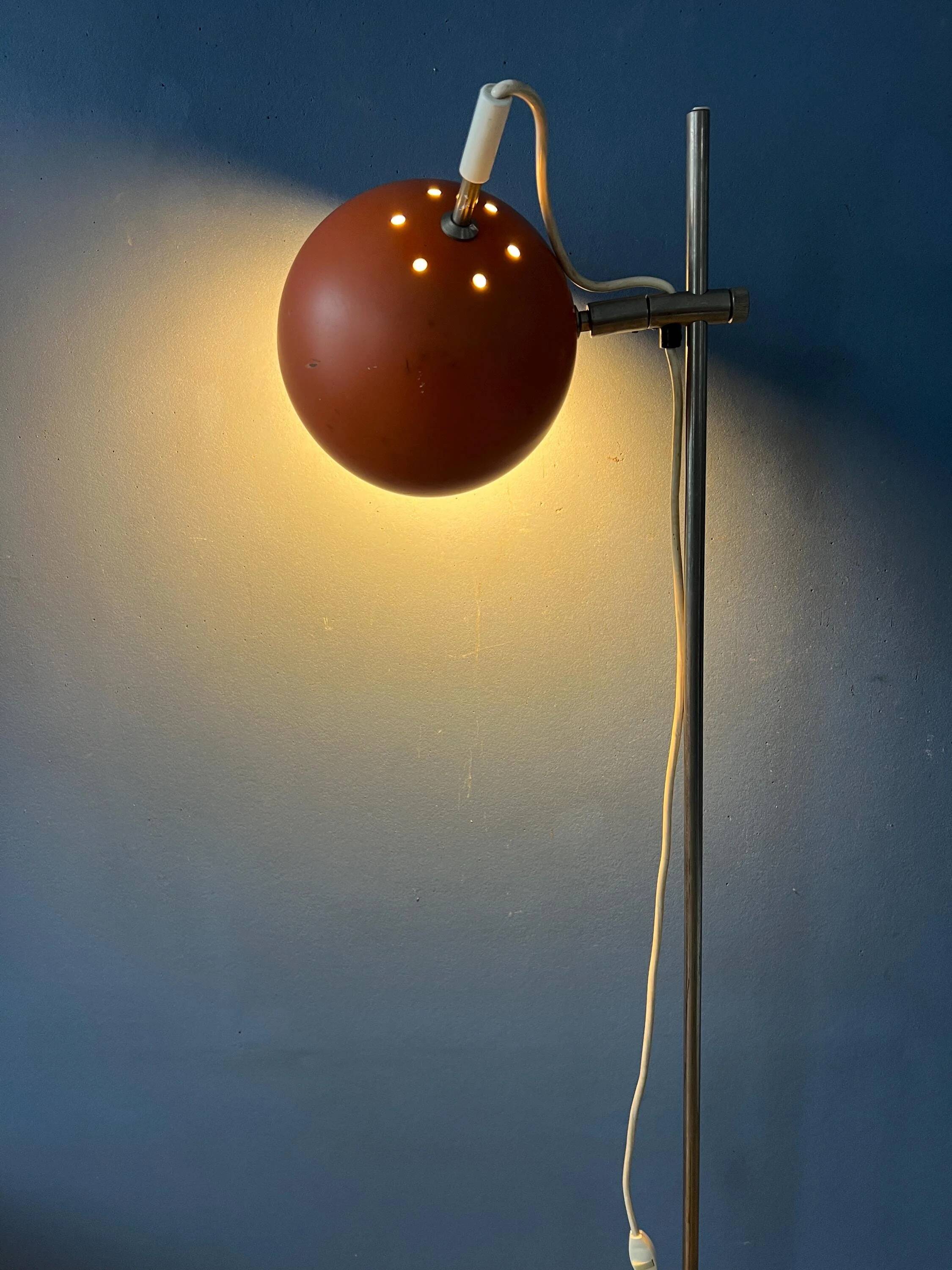 Mid-Century orange floor lamp with "eyeball" shade