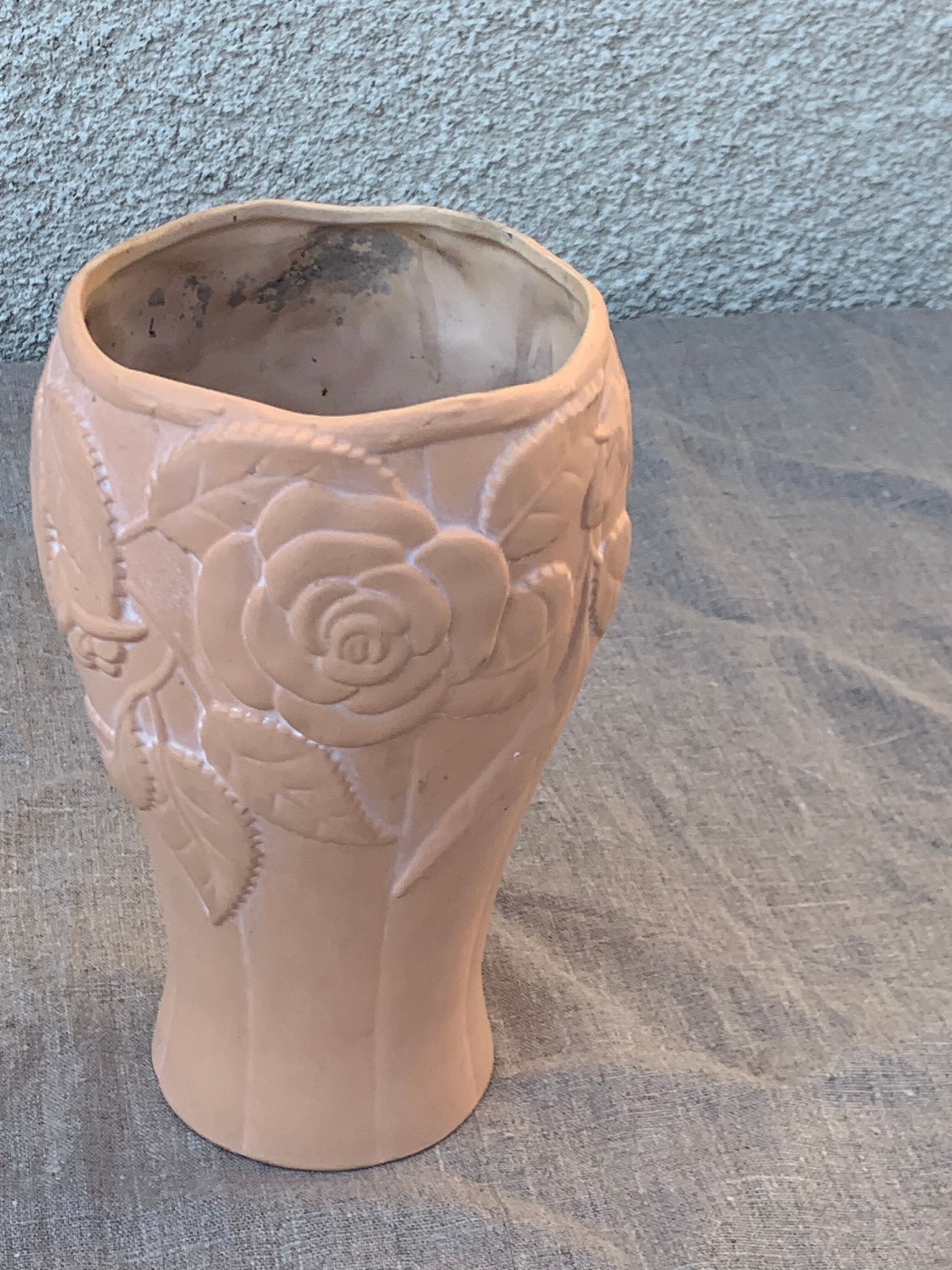 Terracotta vase with a vintage ceramic relief rose pattern