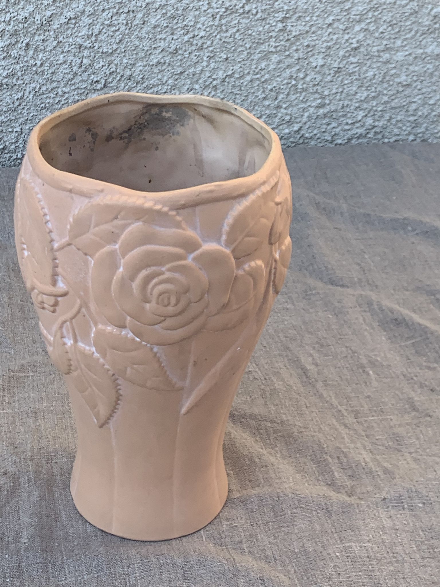 Terracotta vase with a vintage ceramic relief rose pattern