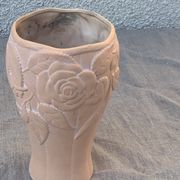 Terracotta vase with a vintage ceramic relief rose pattern