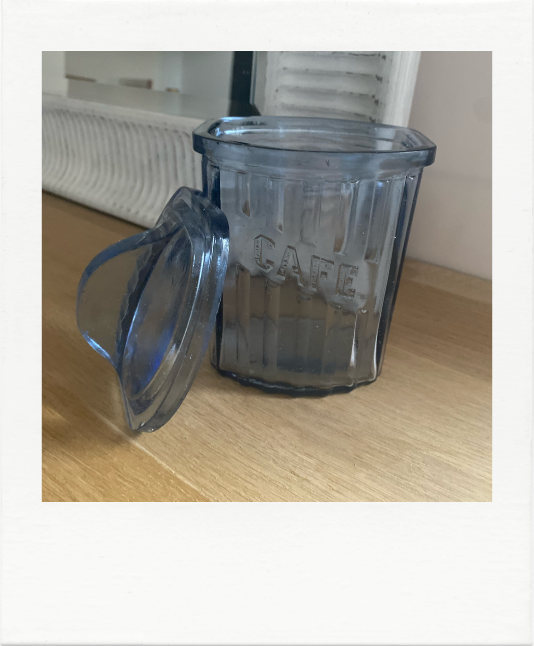 Old coffee pot in blue glass