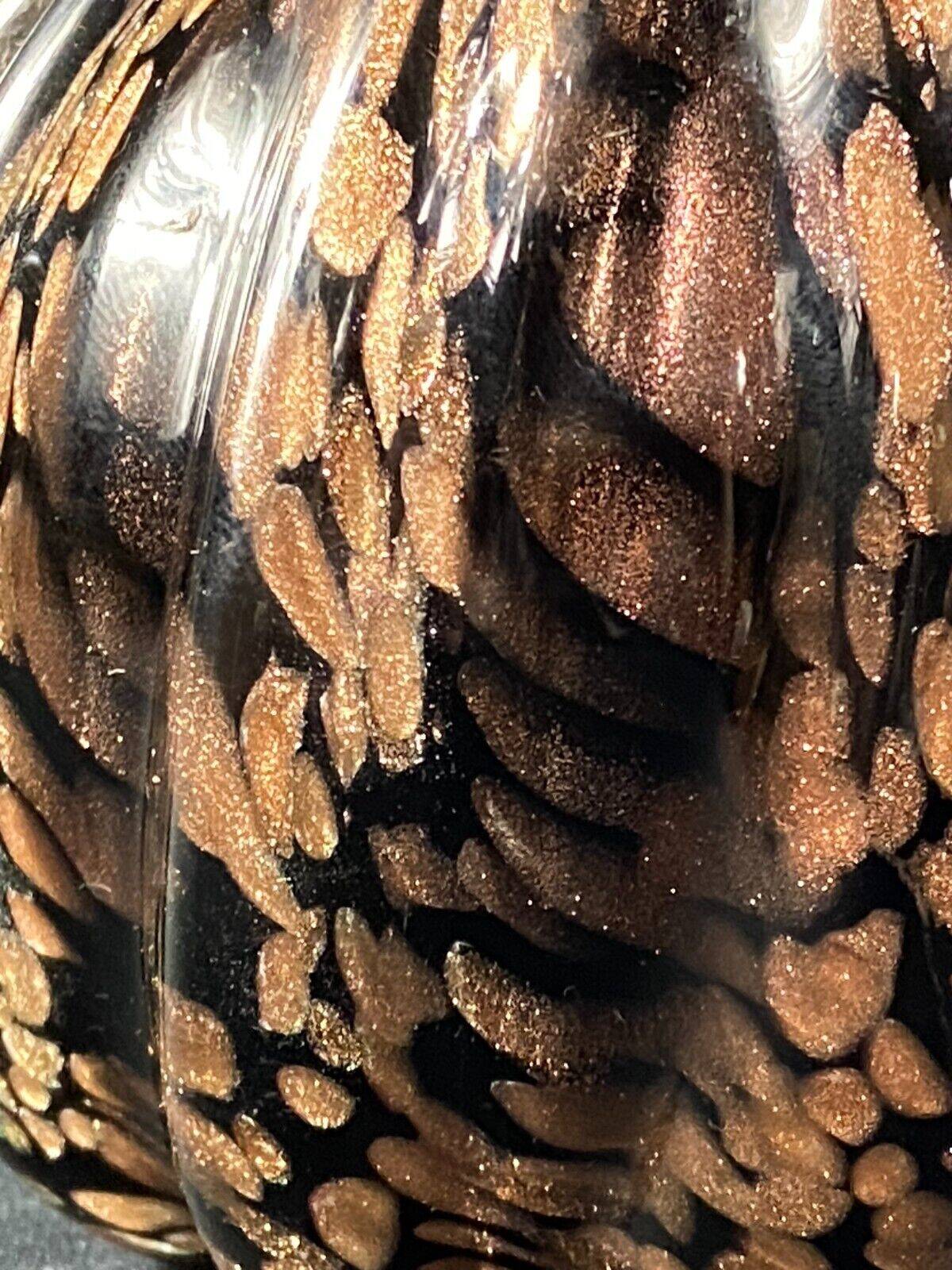 Vase signed in Murano Venice crystal with gold inclusion on a black background