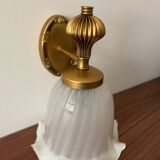 Gold wall sconce with ecru globe