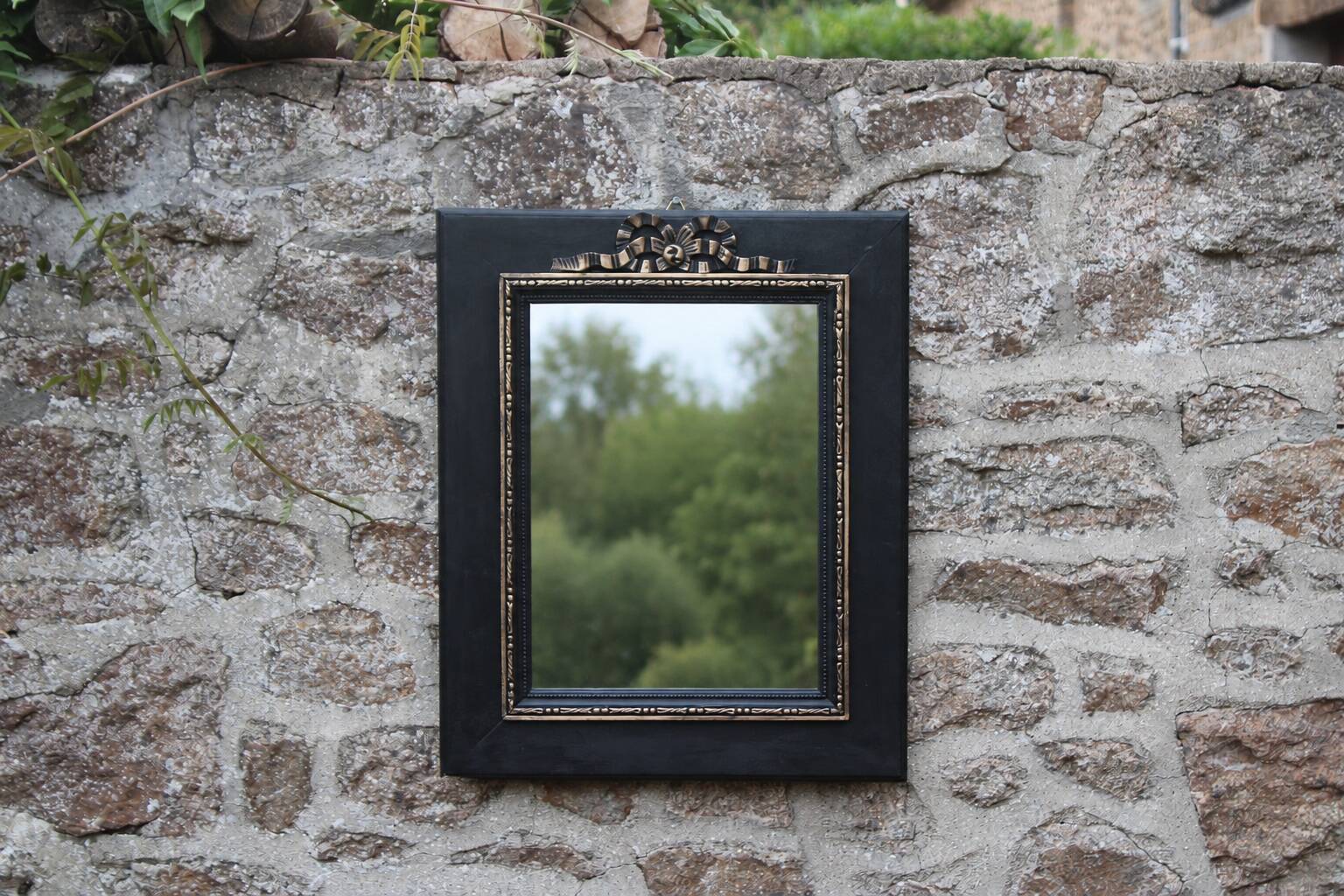 Vintage black and gold wooden mirror with a pediment – Napoléon III style