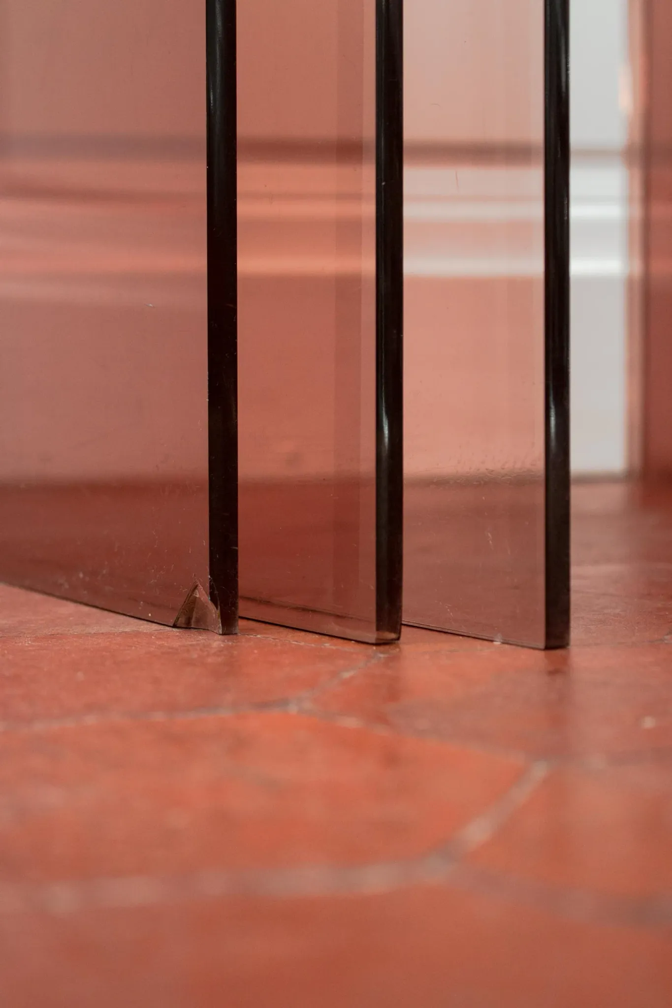 Vintage trio of nesting tables in smoked plexiglass by Michel Dumas, year
