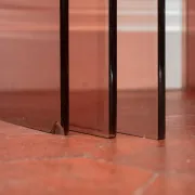 Vintage trio of nesting tables in smoked plexiglass by Michel Dumas, year