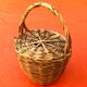 Antique snail basket with woven wicker lid