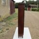 Small solid wooden cabinet with a gendarme hat