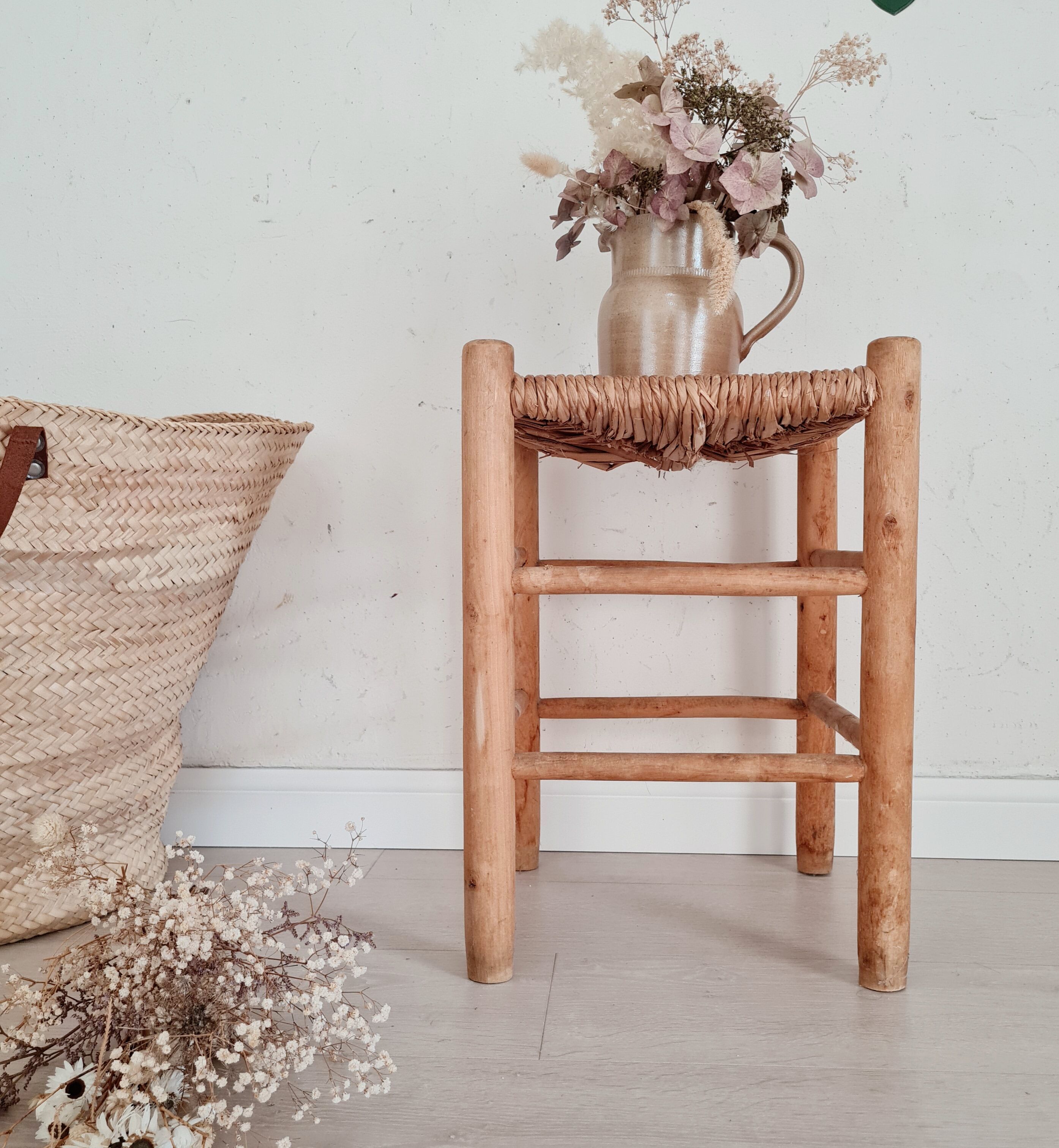 Old stool in wood and straw brutalist look