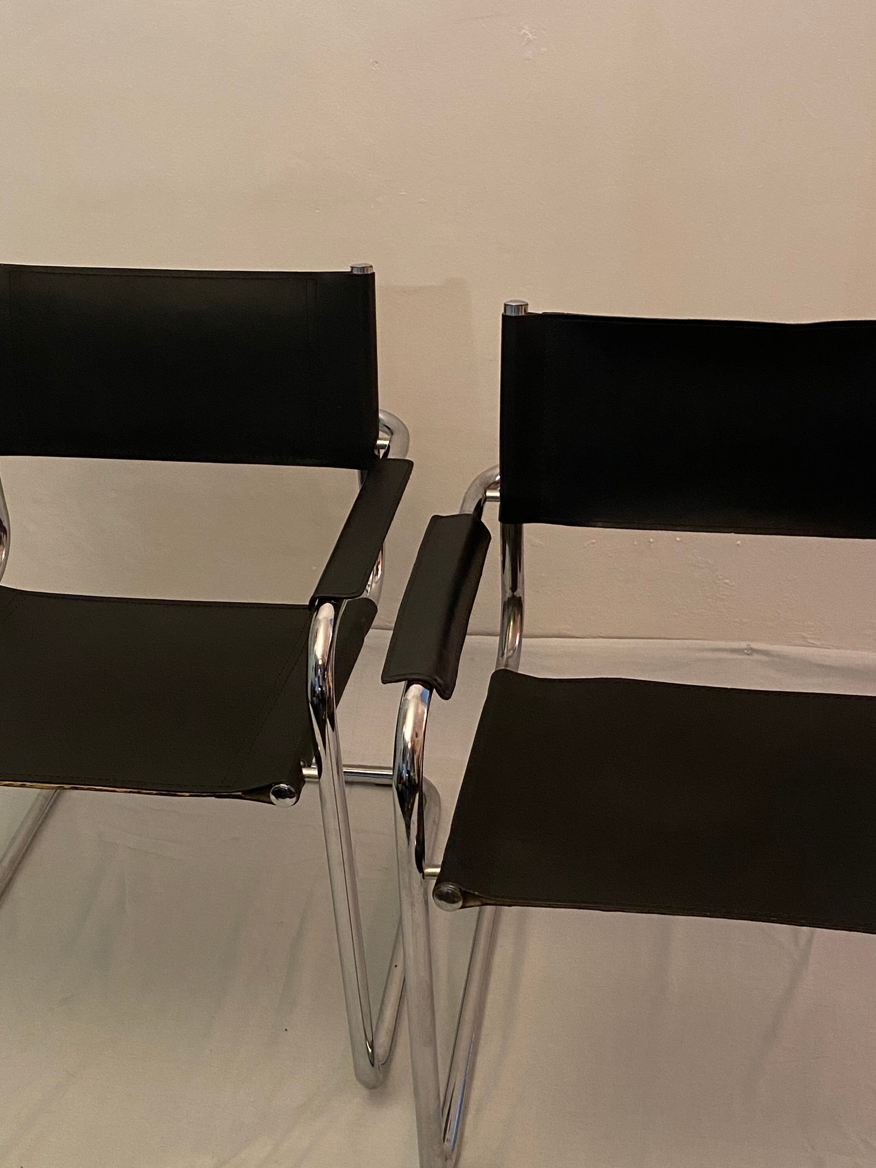 Pair of chrome and leather tube chairs