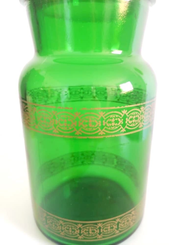 Apothecary jar in vintage green and gold glass