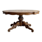 Oval coffee table in walnut burl wood.