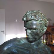 bronze sculpture athlete bending an iron bar by Jean de Roncourt on an art deco marble base