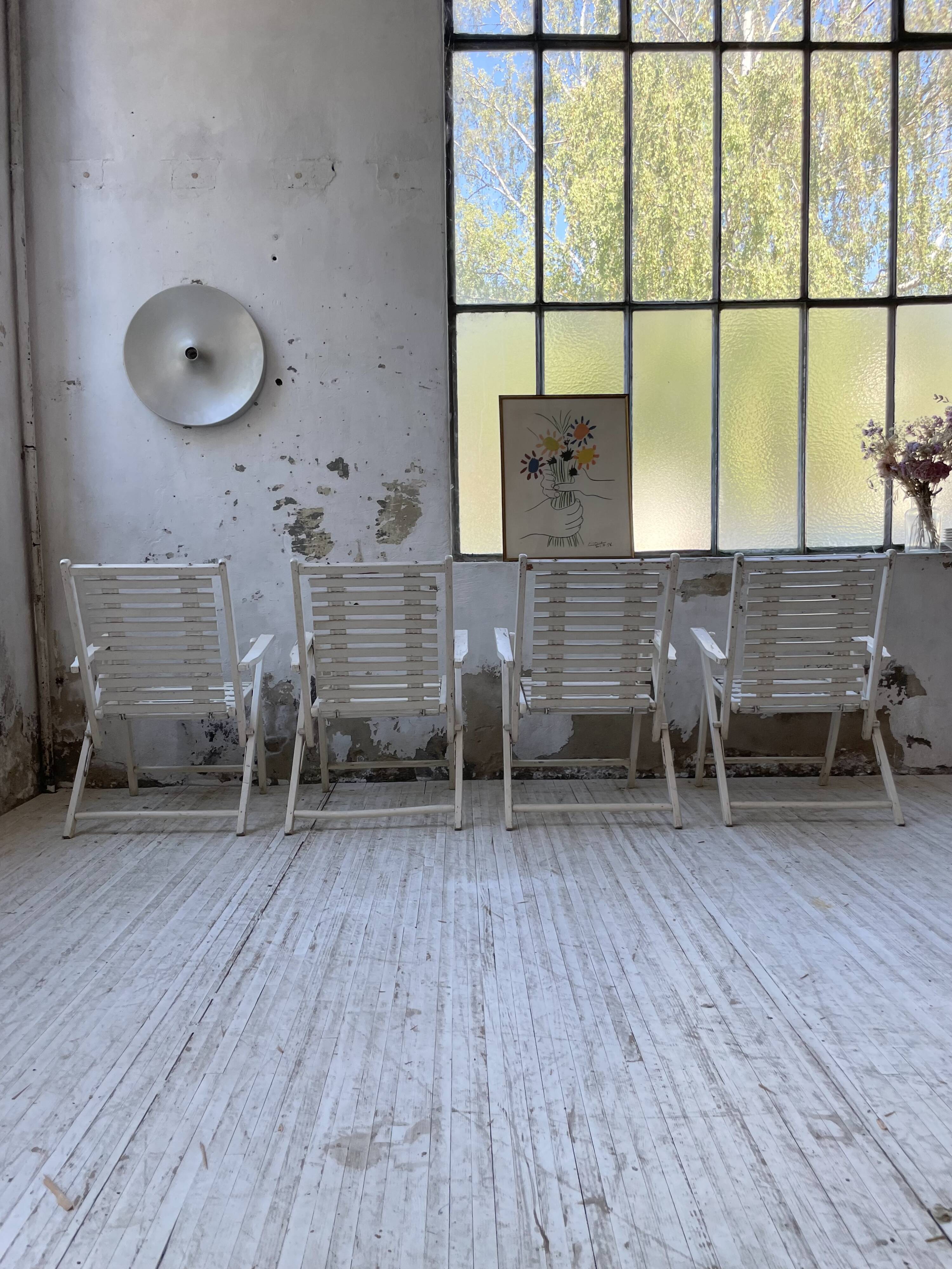 4 white wooden garden chairs