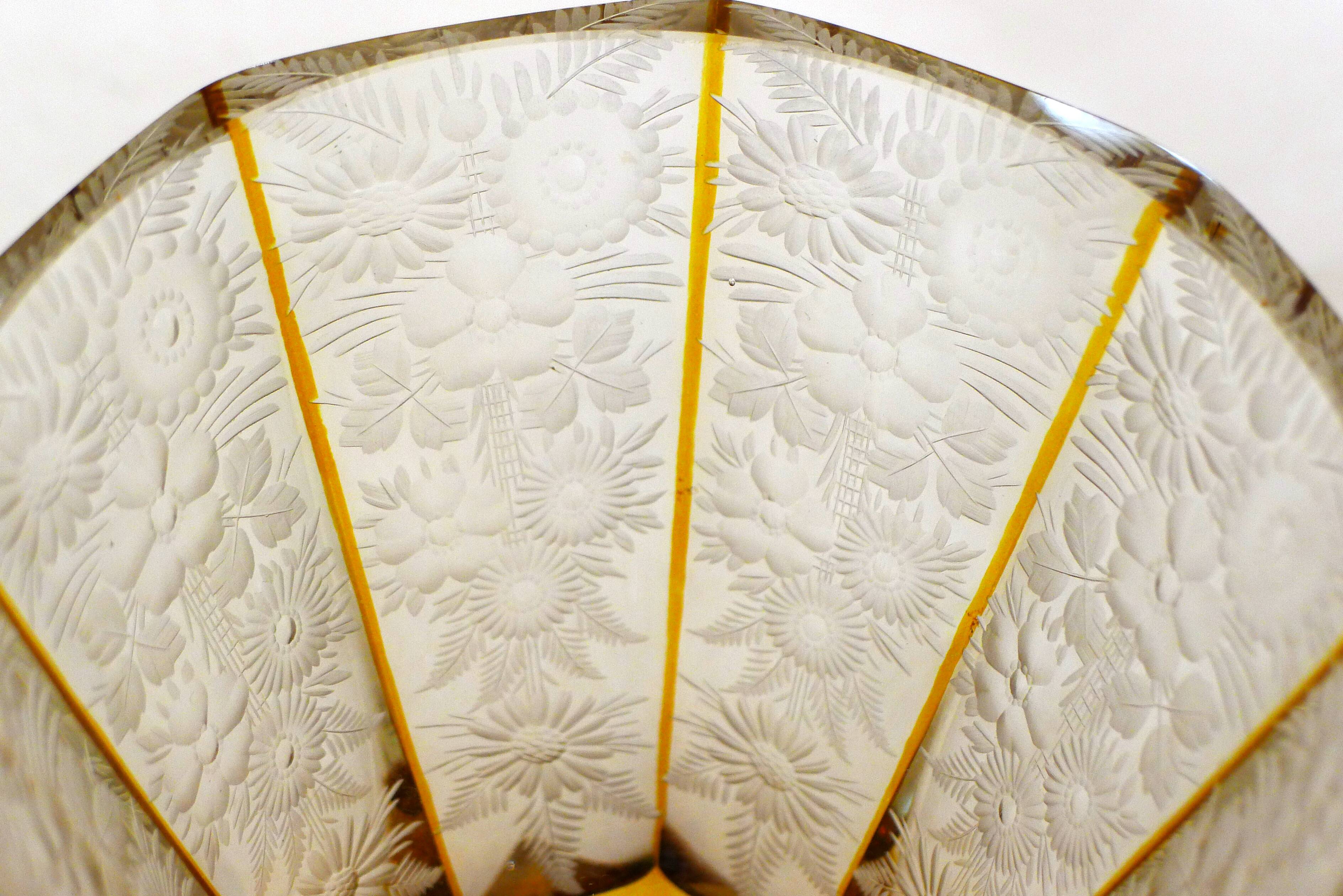 Art Deco vase engraved with flowers, faceted body on a pedestal.