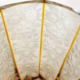 Art Deco vase engraved with flowers, faceted body on a pedestal.