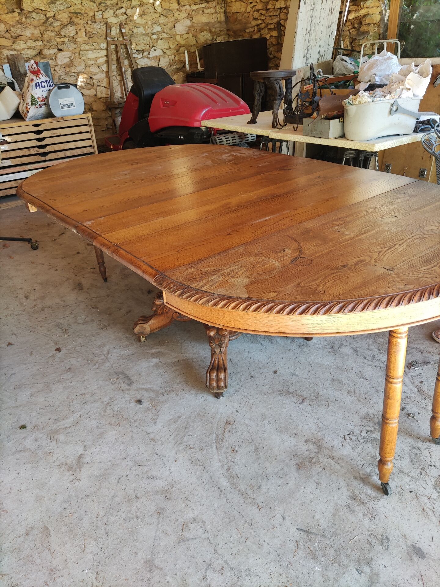 Oval oak table with carved details - known as a hunting table.