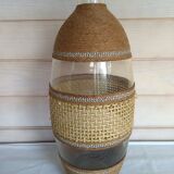Cane glass-decorated vase and natural fibers