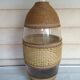 Cane glass-decorated vase and natural fibers