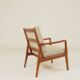 Vintage armchair in olive corduroy with a wooden frame.