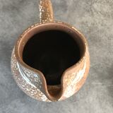 Pitcher in brown sandstone with effect of dripping and white speckling