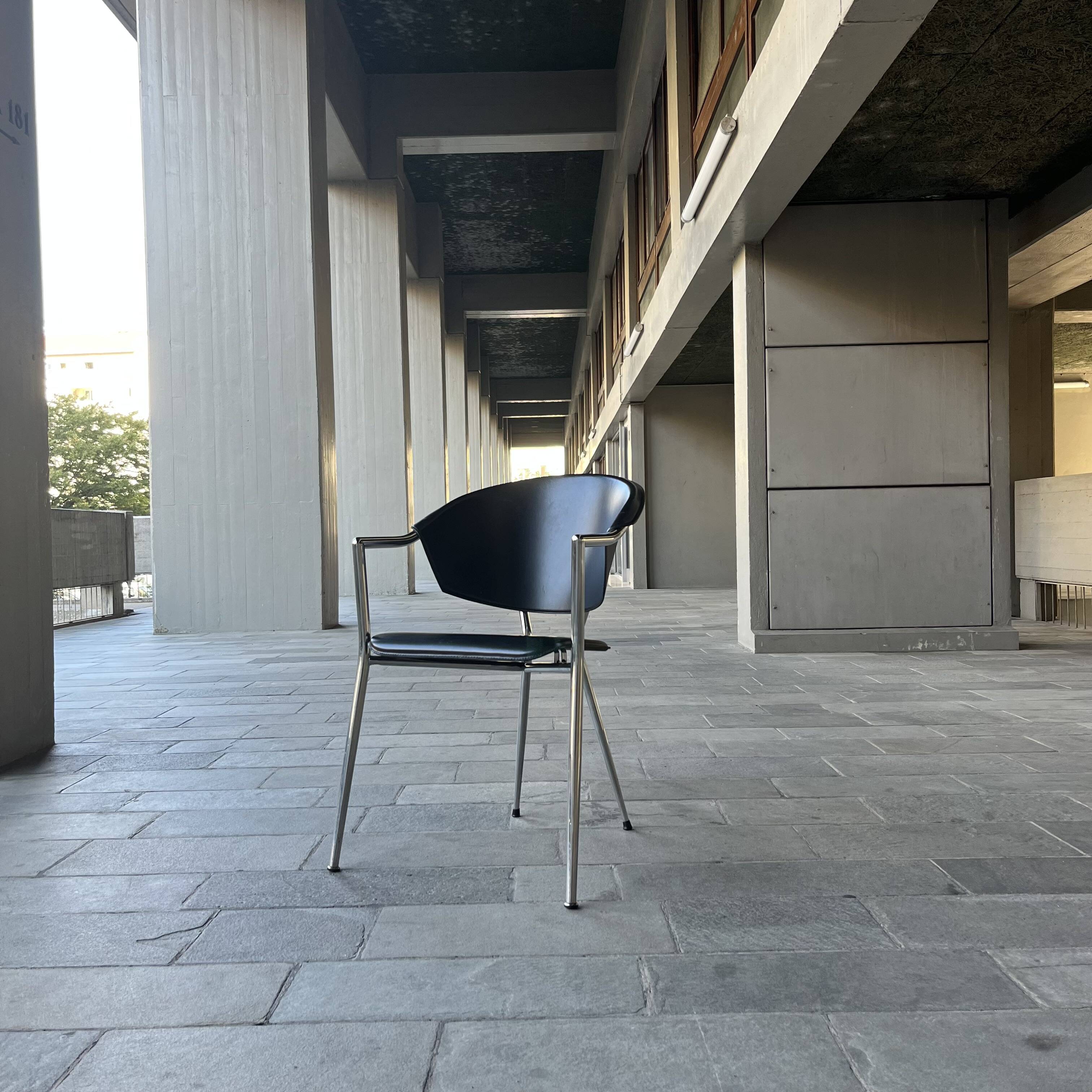 Set of four Italian black leather chairs, 1970