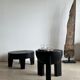 Black mango wood tripod side table with a semi-spherical top, height: 45 cm, diameter: 44 cm.