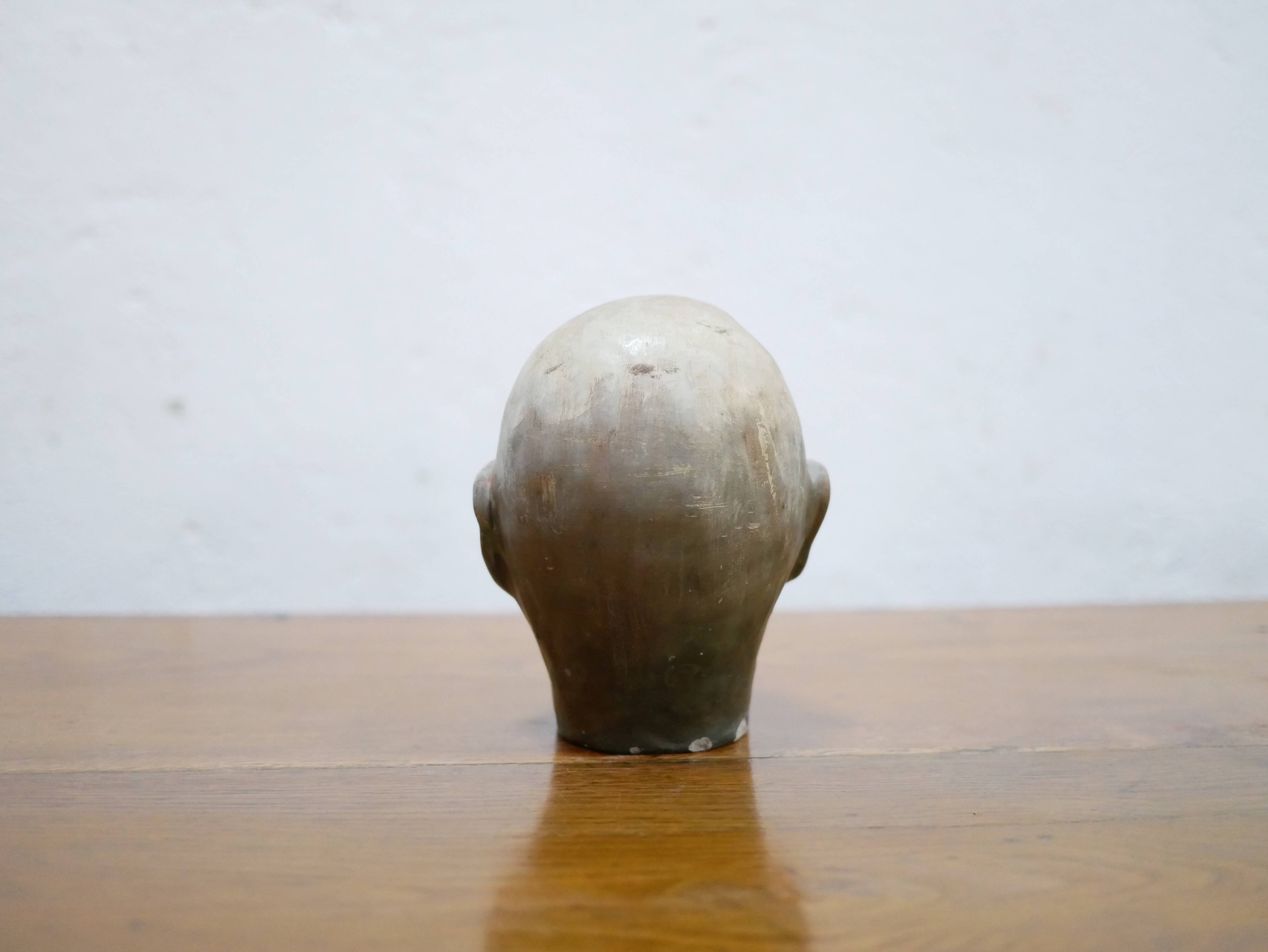 Terracotta head sculpture