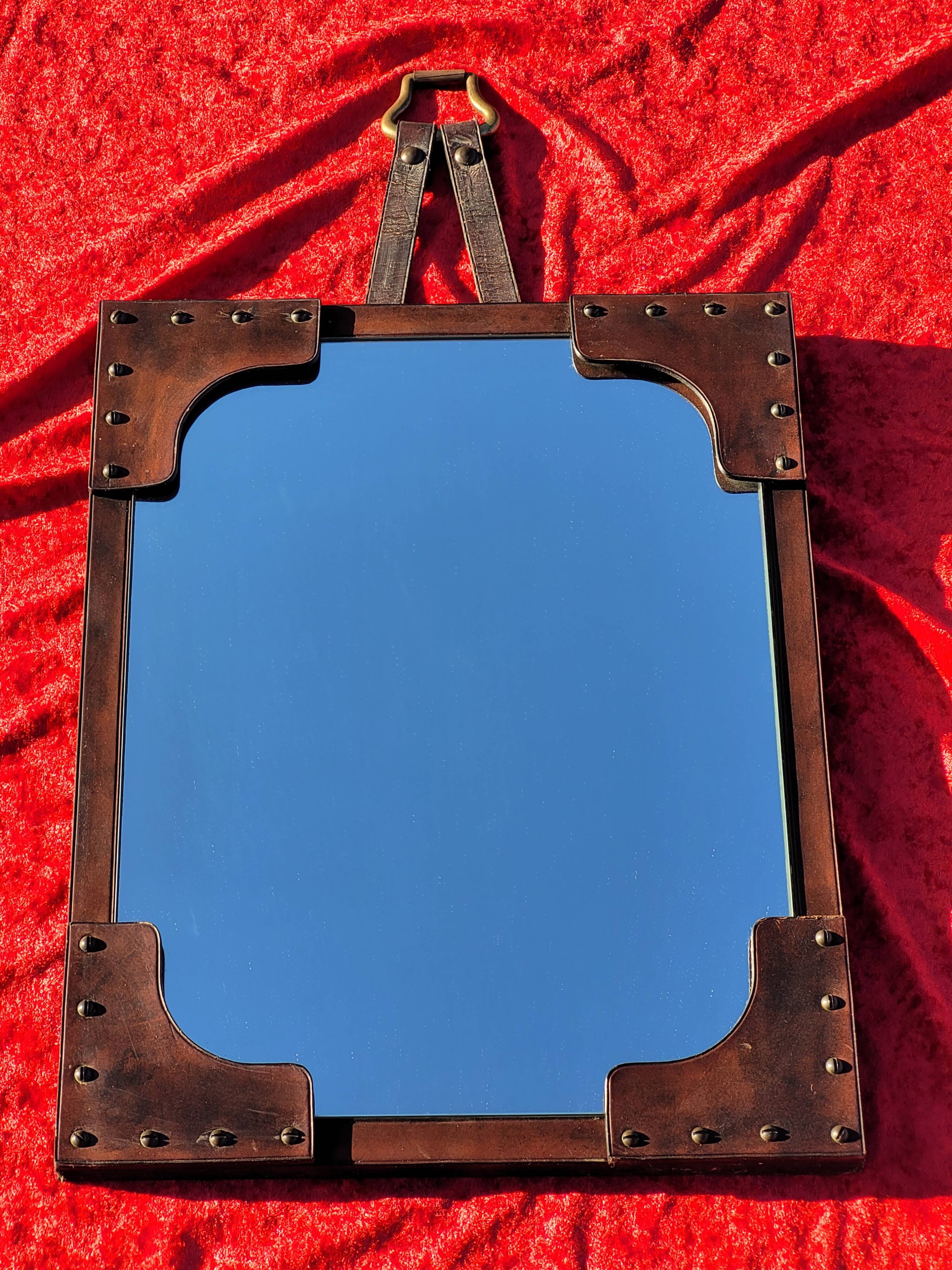 Leather-covered wall mirror attributed to Jacques Adnet 1950