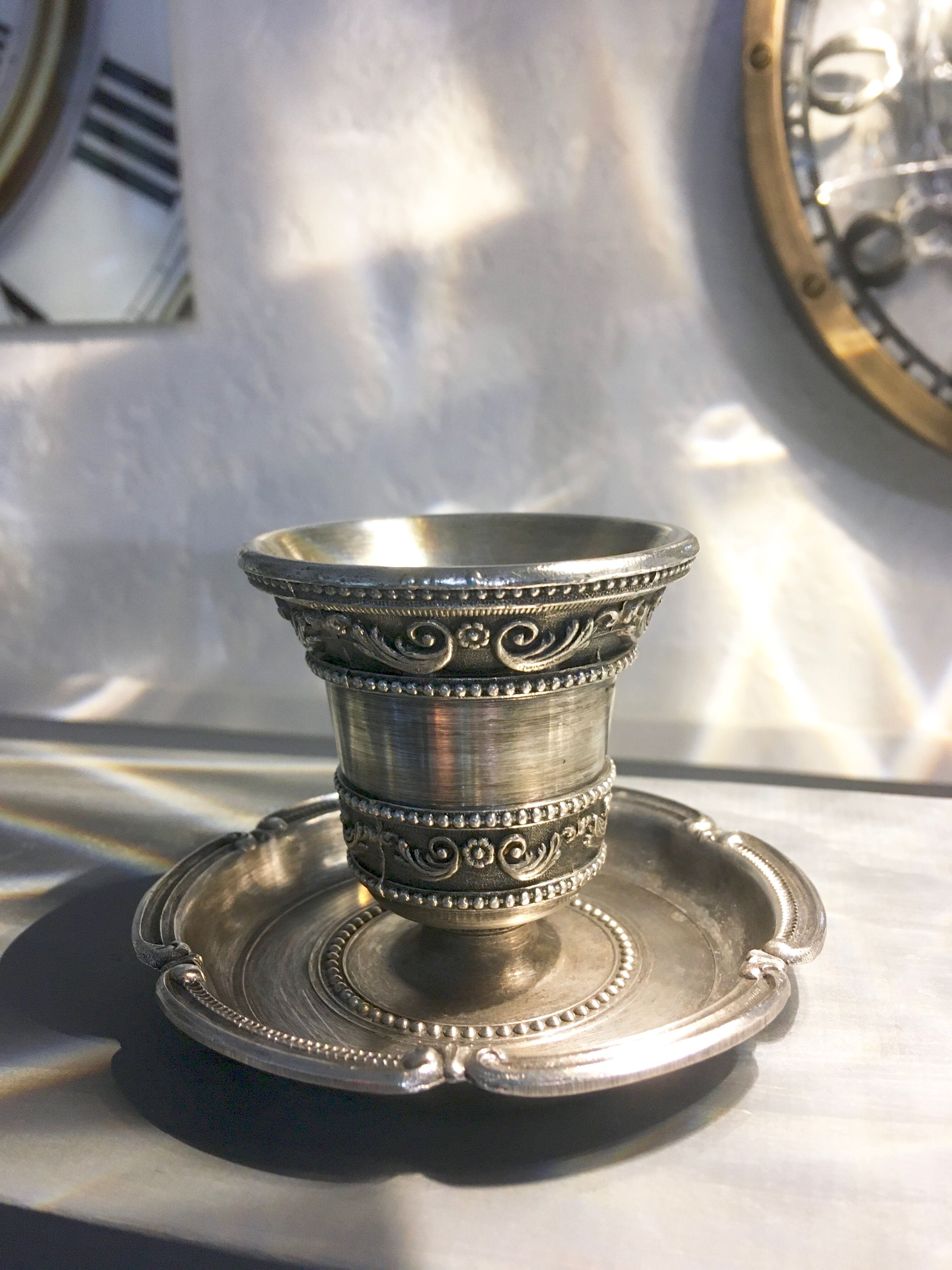 Chiseled silver metal candle holder