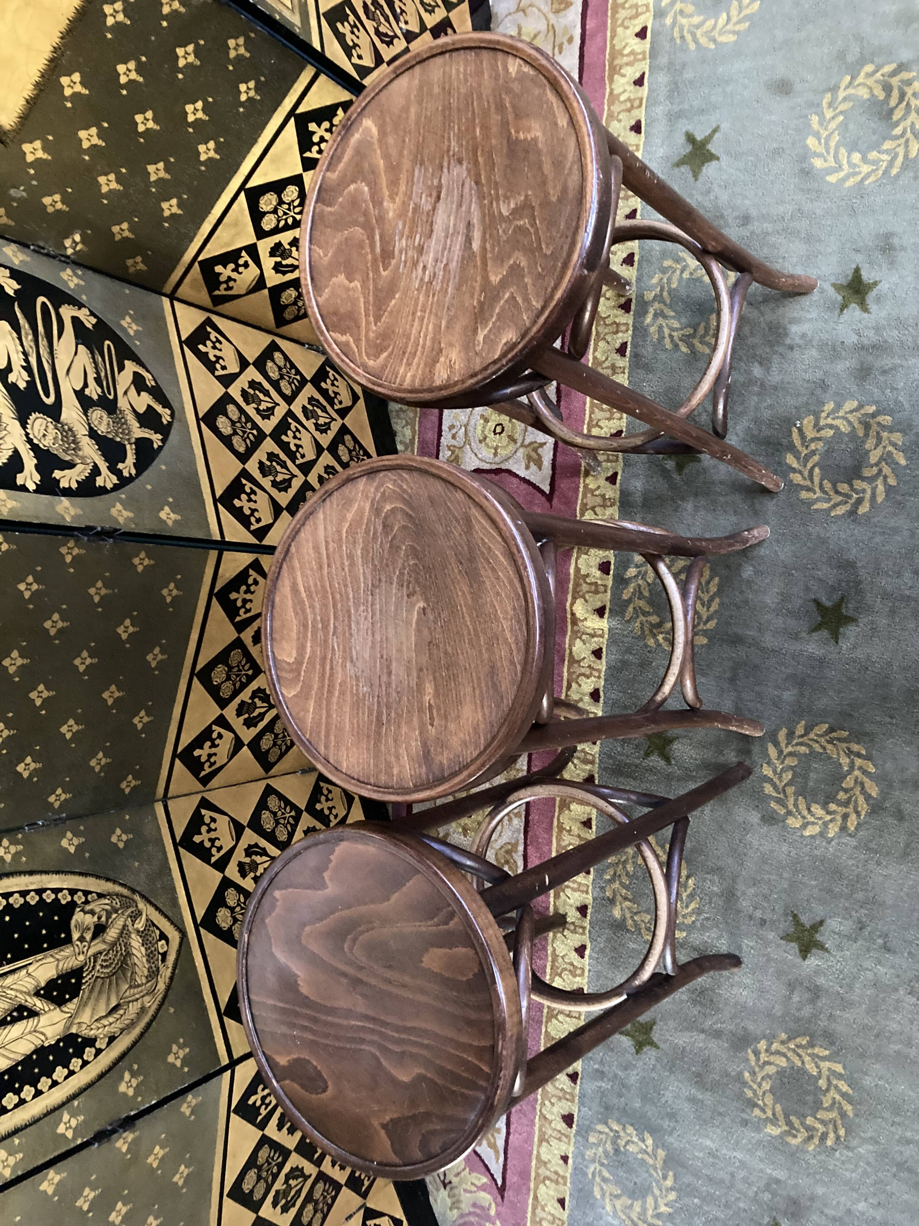 3 curved wooden bar stools
