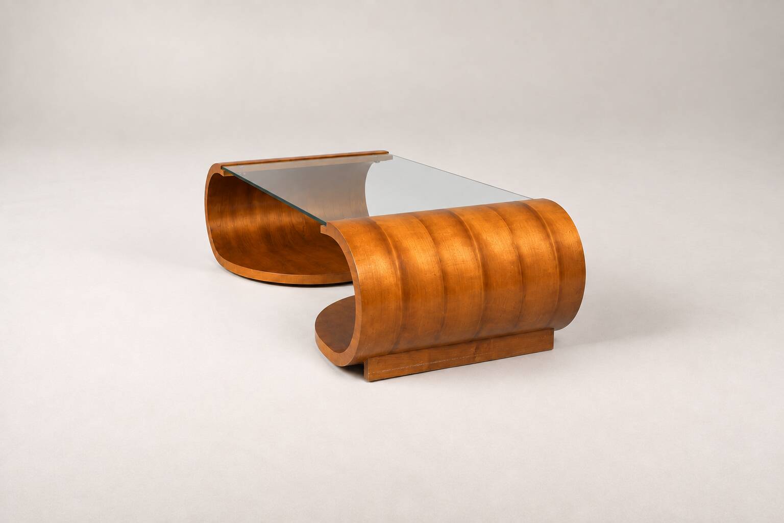 Sculptural coffee table in wood and glass — circa 1970