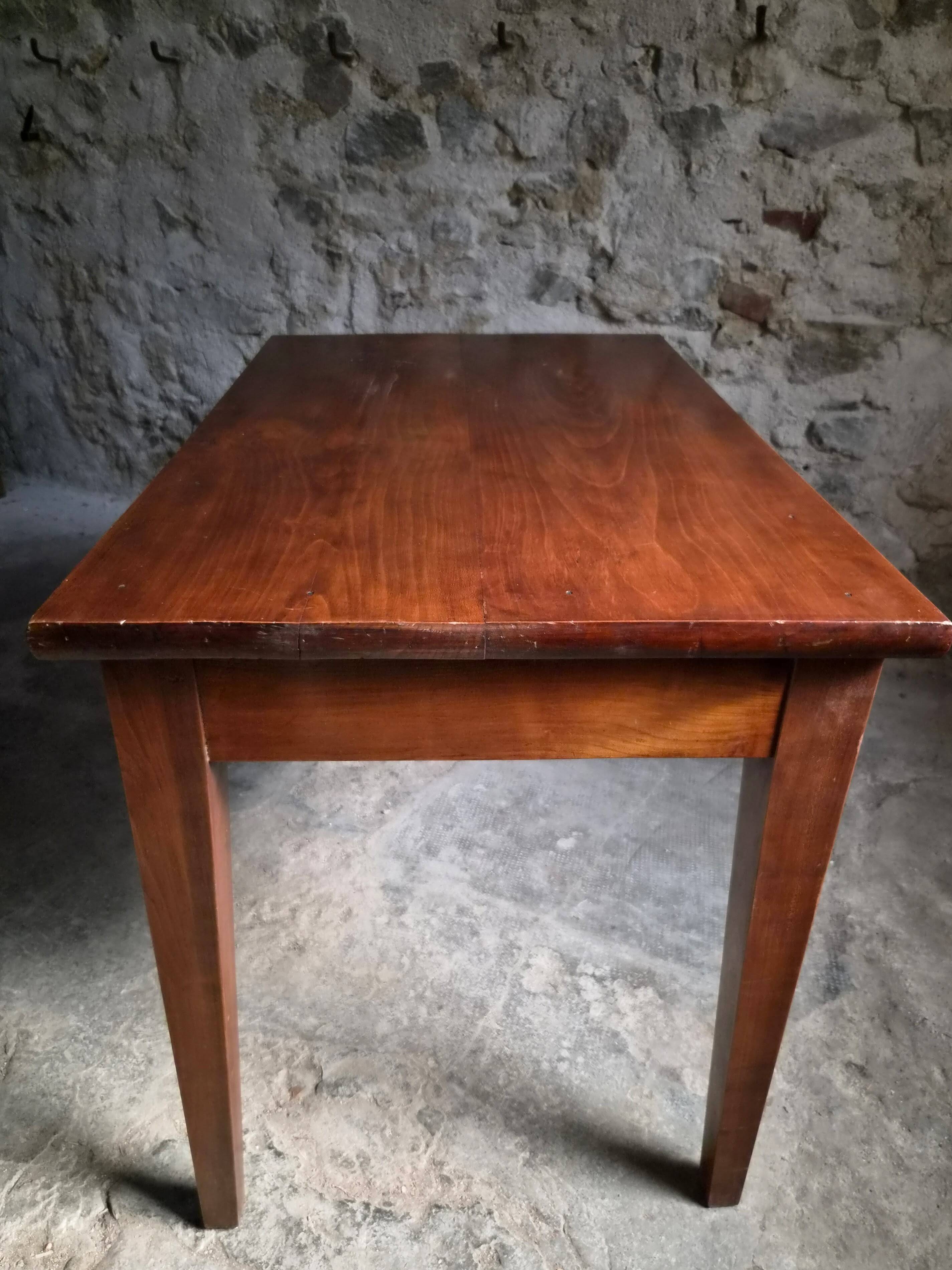 Old French table in cherry wood with bistro chair, circa 1900–1930.