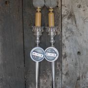 Large pair of silver-plated wall lights with flame globes, torches.