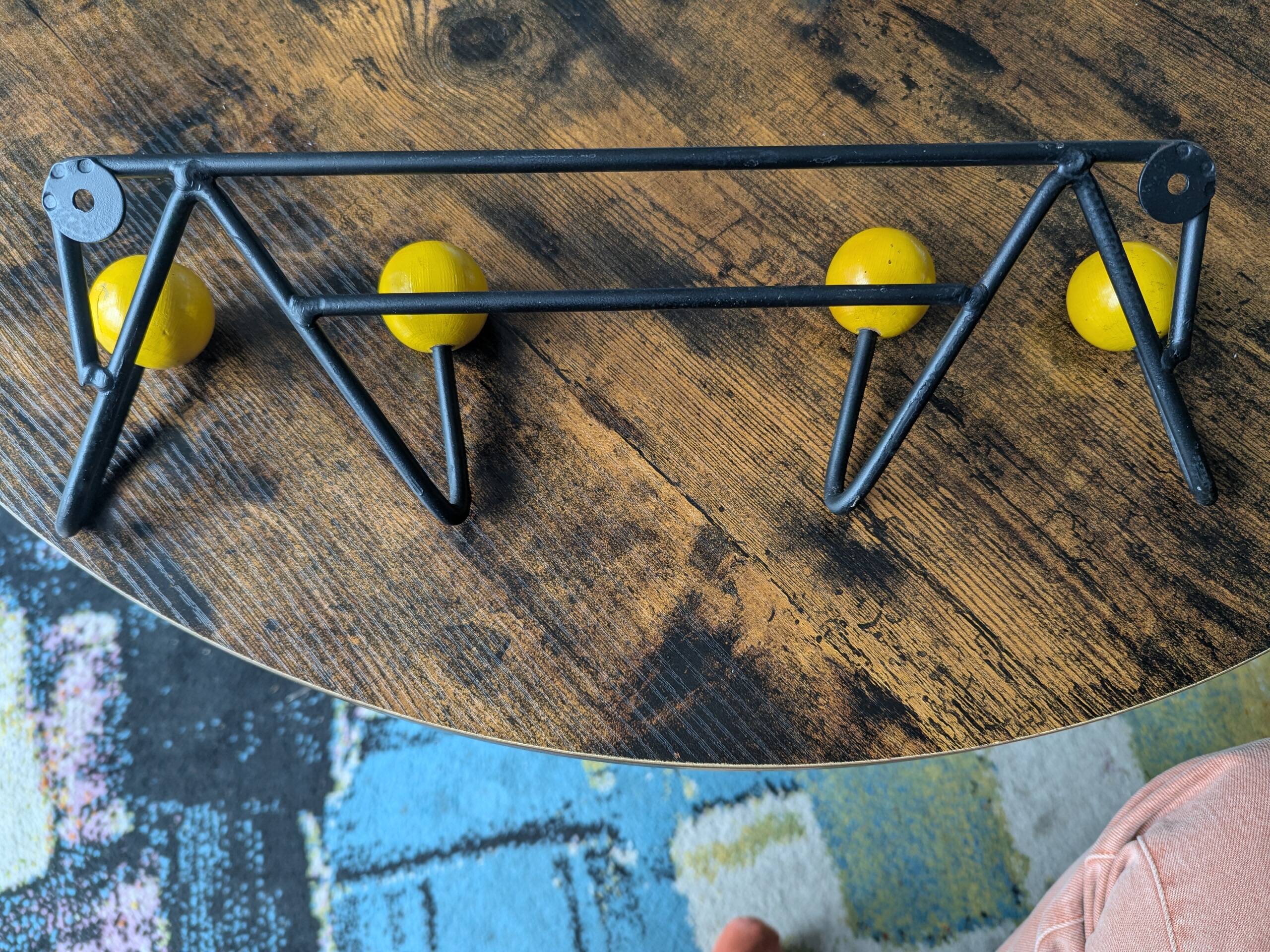Vintage coat rack Roger Feraud with 4 yellow ball hooks.