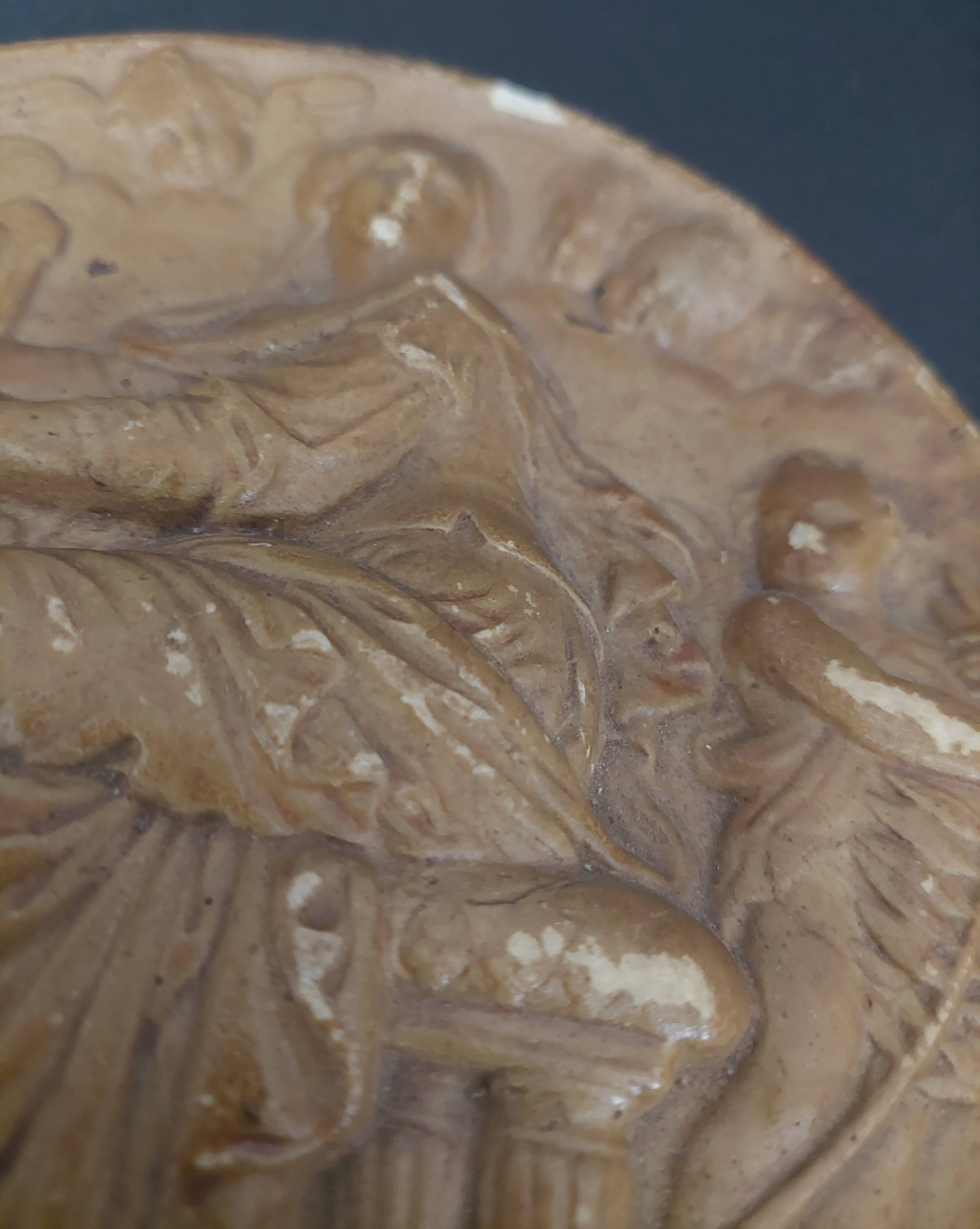 Tondo medallion in patinated plaster, woman and putti, late 19th century