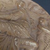 Tondo medallion in patinated plaster, woman and putti, late 19th century