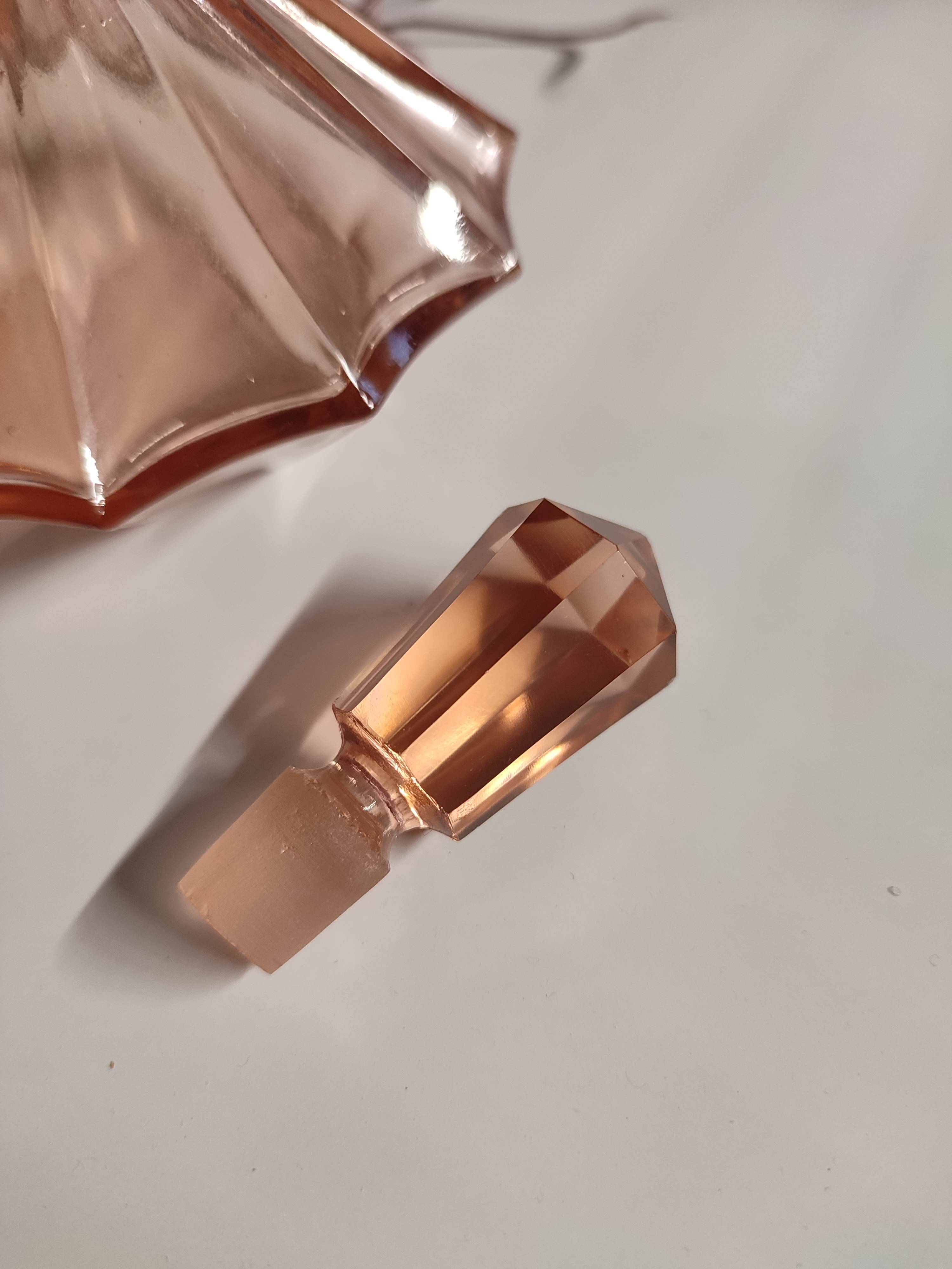 Vintage Art Deco perfume bottle in beautiful pink glass.