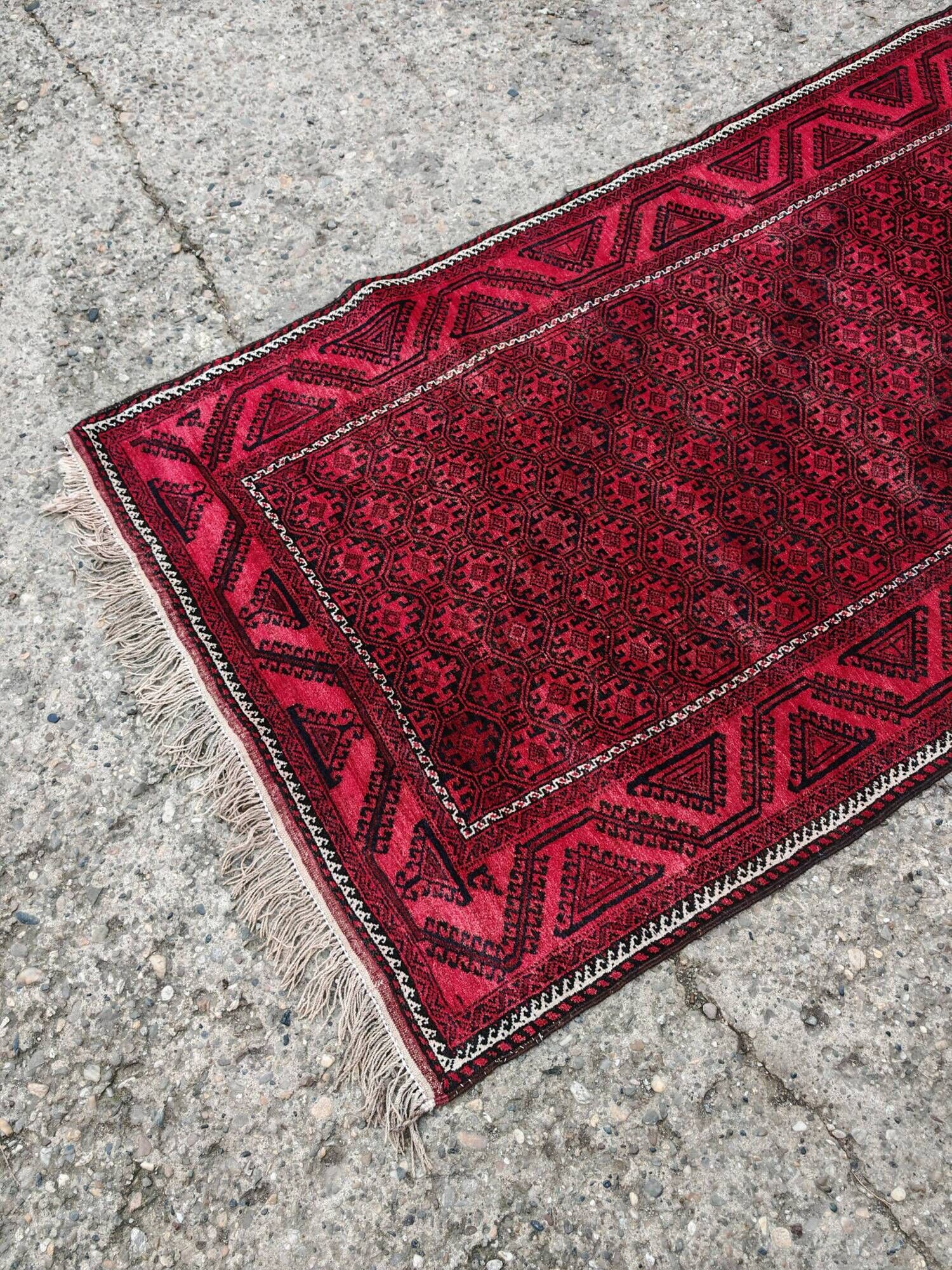 Vintage handmade Baluch rug with geometric pattern from the 1950s.