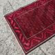 Vintage handmade Baluch rug with geometric pattern from the 1950s.