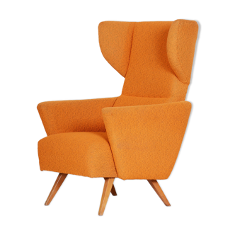 Orange wingback armchair, original condition, made in 1950s czechia