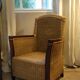 comfortable colonial-style armchair in rattan and mahogany