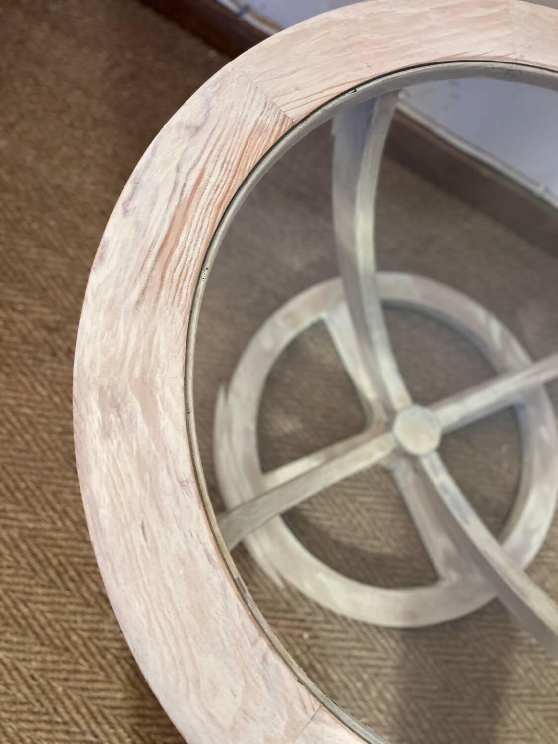 Oval patinated wood and beveled glass coffee table