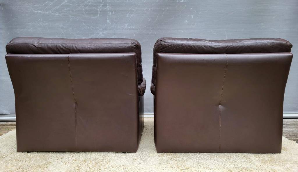Pair of chocolate leather lounge chairs