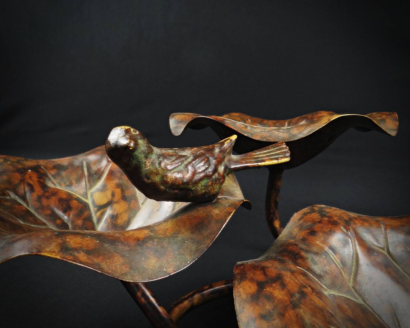 Three-tiered lotus leaf shaped patinated metal bird bath