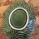 Vintage leaf-shaped green majolica catchall.