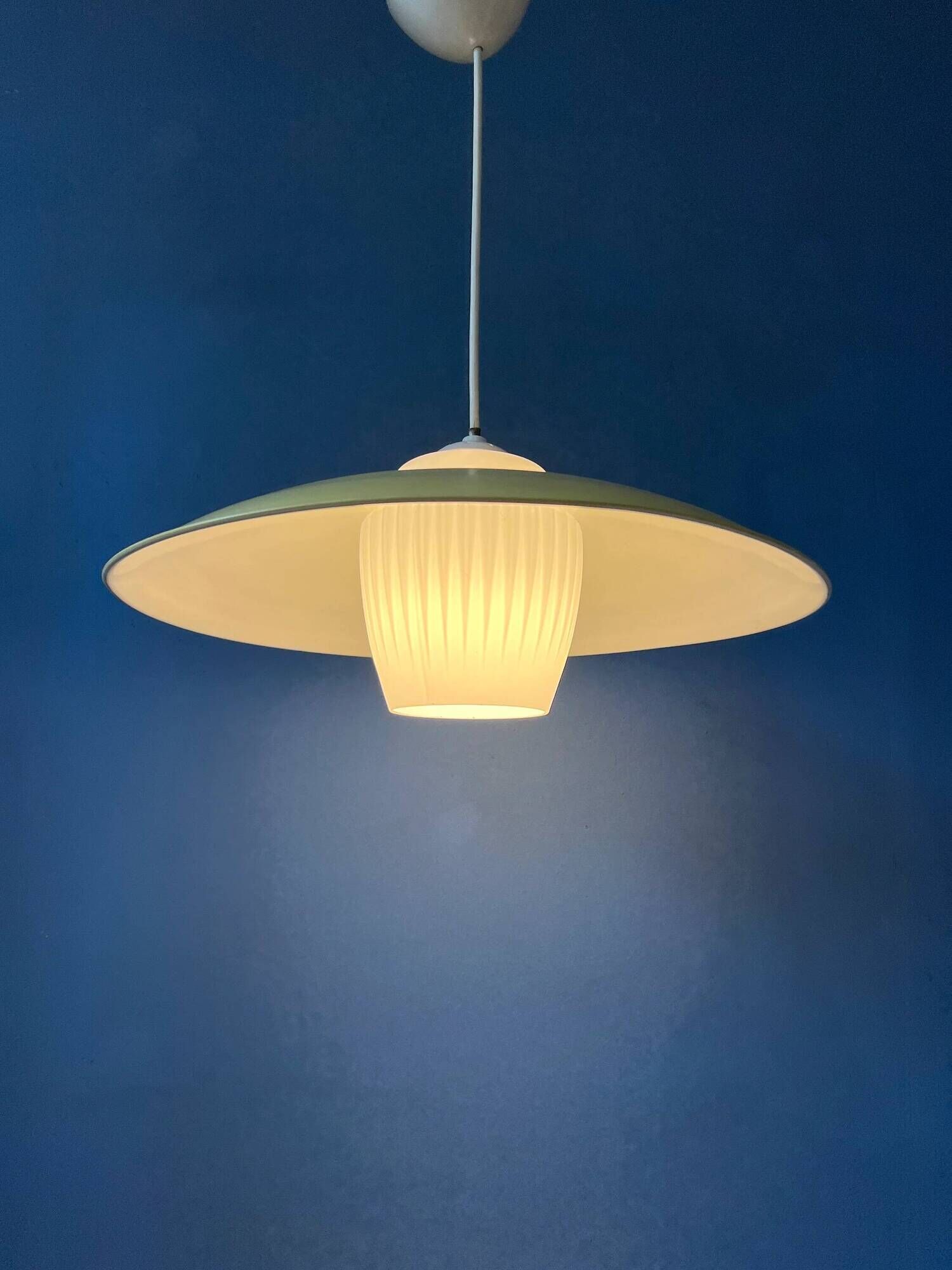 Danish mid-century suspension with opaline glass shade and yellow metal cover.