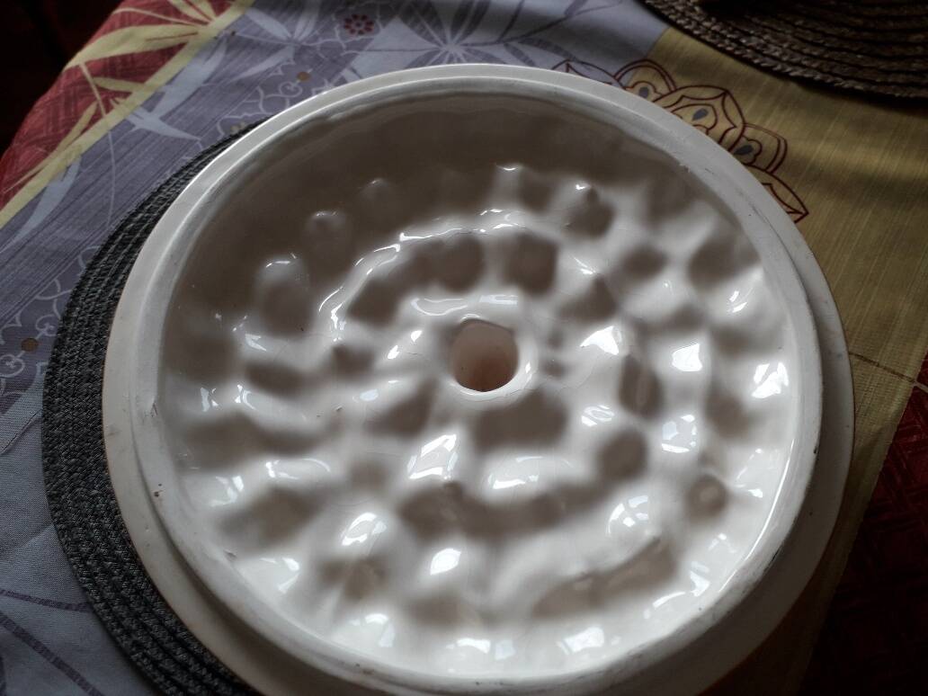 Glazed ceramic dessert plate with strawberry design.