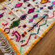 Berber carpet azimuth colored white with multicolored and fluorescent patterns